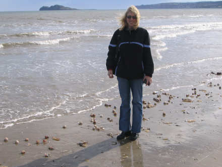 She found a live clam that washed up and tossed it back to safety!