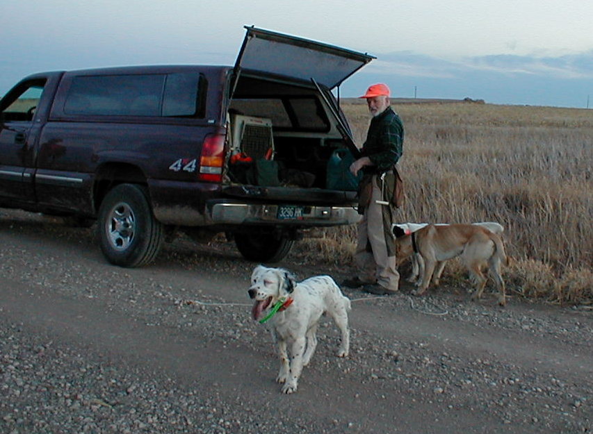 Another shot of Steve and his dog Ralph and his wife Menita's dog Jack and Sara Lemmer's dog Pepsi are getting a drink....