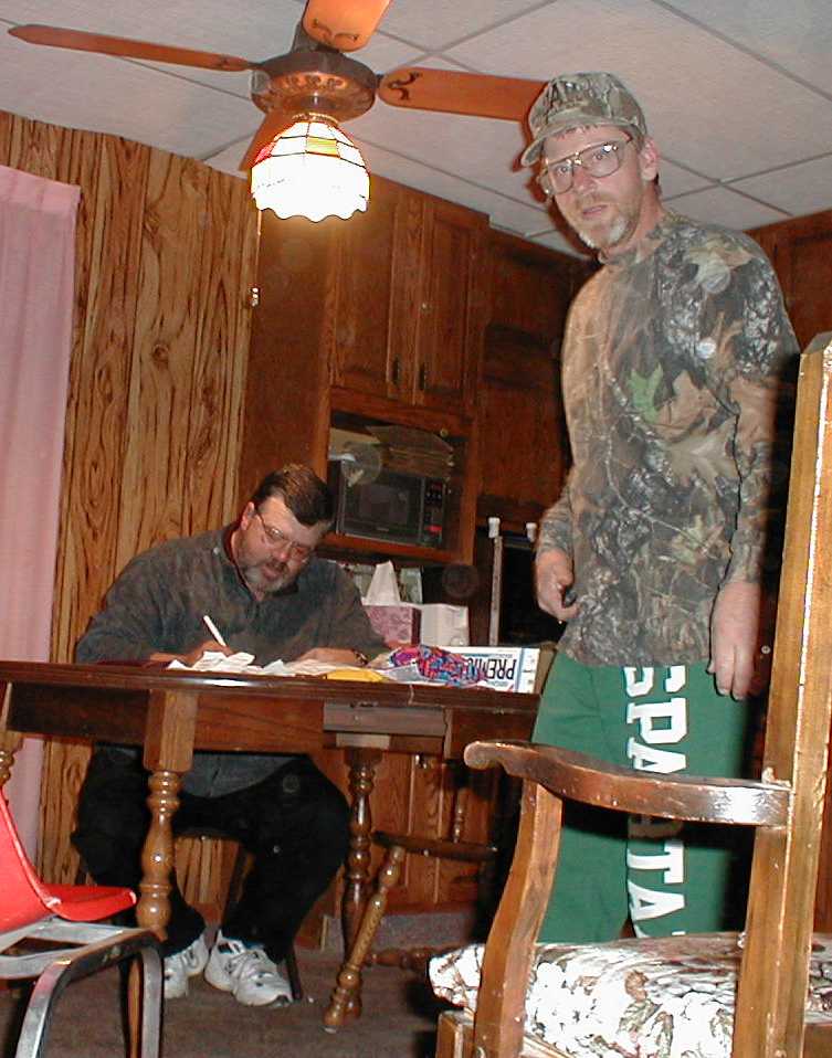 Big Dave looking as studious as ever as he divides up the bills...