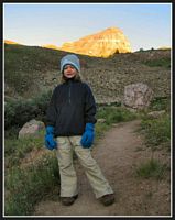Kendall, heading up trail;&nbsp; Uncompahgre Peak in background