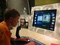 Cole piloting a probe and taking pictures of Mars' features for analysis.