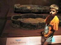 Yes, it is an actual mummy in the case display.
