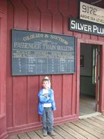 Cole checks the departure / arrival board.
