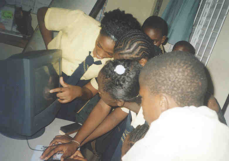 Students at the only IBM computer donated by Jamaica Farewell