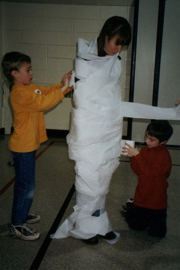 Dorothy being wrapped in toilet paper