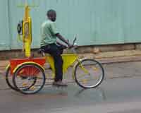 A 'MOBILE' TELEPHONE BOOTH MOUNTED ON A BICYCLE