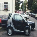 I know this isn't a picture of people, but I wanted to show you the city car quite popular in Stuttgart.  It's called a SMART.  It's tiny, but I rode in it and it's actually pretty roomy for two people.  For comparison, parked behind it is a regular compact car.