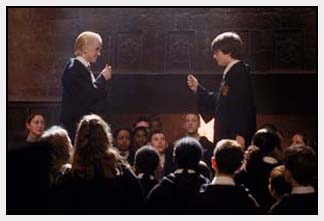 Draco Malfoy (Tom Felton) and Harry (Daniel Radcliffe) prepare to duel