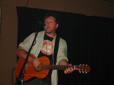 Image: Richard Buckner playing nylon-string guitar