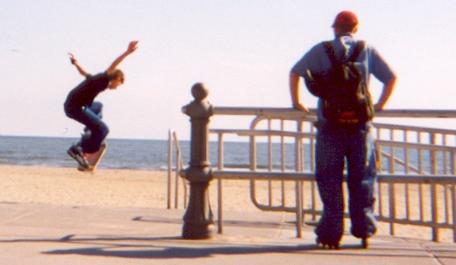 Justin on a skateboard with Zack at VA Beach