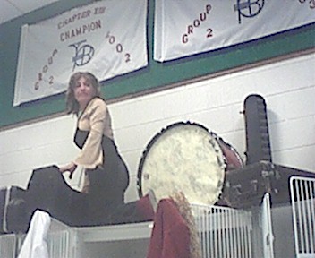 Rigo's Mom climbing on top of the lockers to hold the pi�ata...