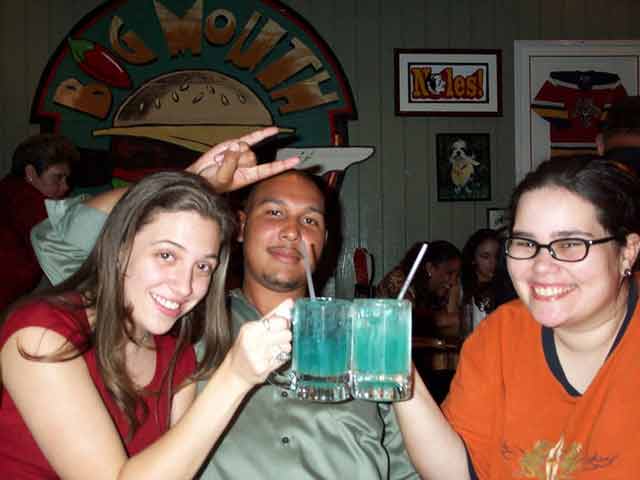 Michelle and I toasting our delishous drinks and my honey encouraging my drinking