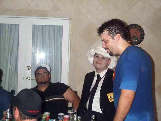 Greg, Pat in Liz's hat, and Erick drenched for an unknown reason.