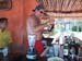 Norm sneaking behind the bar to fix himself a drink