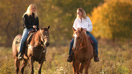 girls riding horses