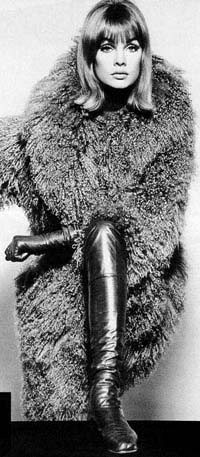 Jean Shrimpton in thigh boots, leather opera gloves and fur coat - Jean Shrimpton met photographer David Bailey on a shoot for a cornflakes advertisement. His friend told him she was too posh for him, but Bailey thought 'we'll see about that!' The couple had a relationship for four years. In 1965 she arrived for the Melbourne Cup in Australia and shocked everybody by wearing a plain white shift dress which ended at least 10 cm above her knees. To make things worse she wore no hat, stockings or gloves. This was very controversial at the time, but Jean was blissfully unaware of the riot she caused.