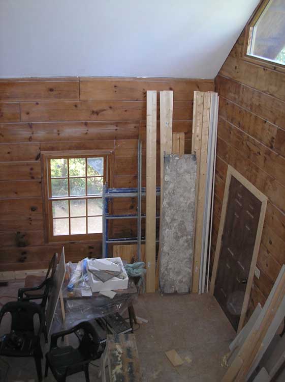 19_Living_room_view_from_scaffolding_with_trim_around_door_and_floors