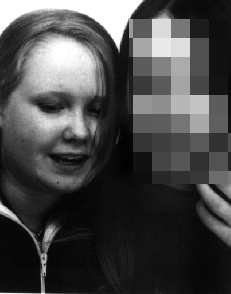 this is a photo of me and georgia in watford, (i've blurred out my face so u can just see her) we're trying to work out how to work the photo booth... we never did manage...