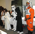 Some of the many costumes in the costume contest - including a Stormtrooper and an X-wing pilot... double click to see larger version in JPEG format
