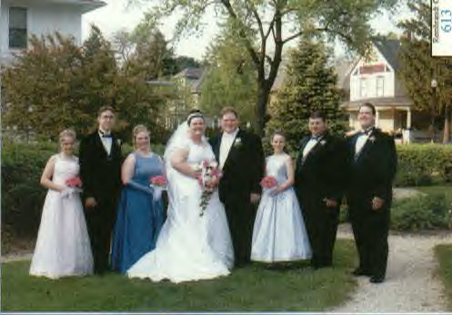 The wedding party in the church garden after the ceremony