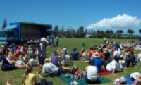 The crowd enjoy the weather at the prize giving