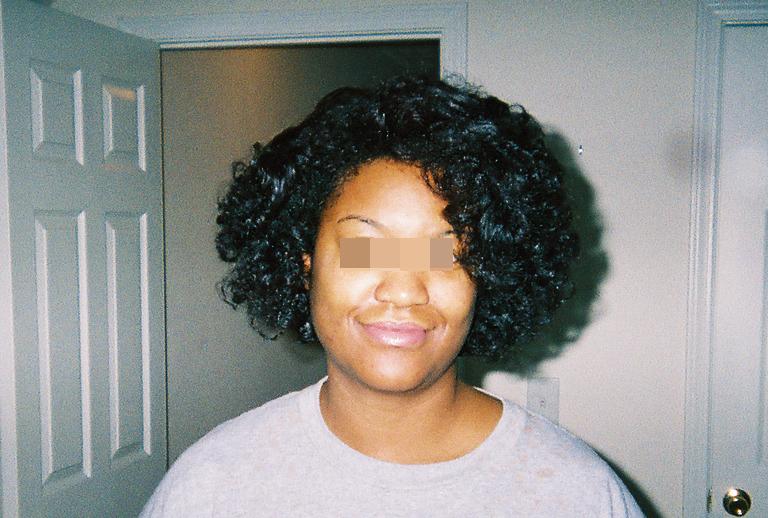 Now - don'tr do what I did here. I simply fingercomb my hair. Instead, to avoid this bouffant look, wrap your hair and let it set as a wrap, or if your hair is long enough, pull it back into a ponytail. All-in-all you can have a nice rollerset without the use of heat 8o)