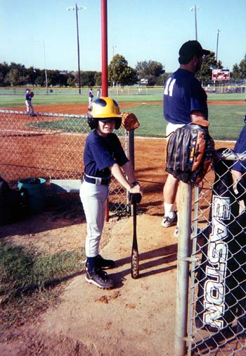John playing baseball