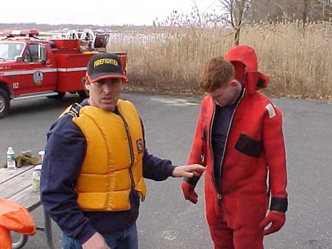 Bill helping Greg get the dry suit on