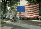 The team in front of a giant USA flag. Apeared in the Naperville Sun.
