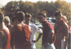 Coach Cyr talking to John, Alan, and Jack after Regionals