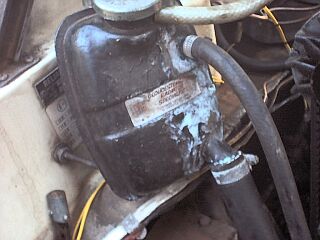 Yeuch! - The little top pipe had come loose and was widdling coolant down the tank. 
