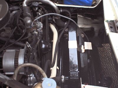 This is where the fan sensor clips - under that stainless bracket where it bends 90 degrees - on the engine side at the moment.