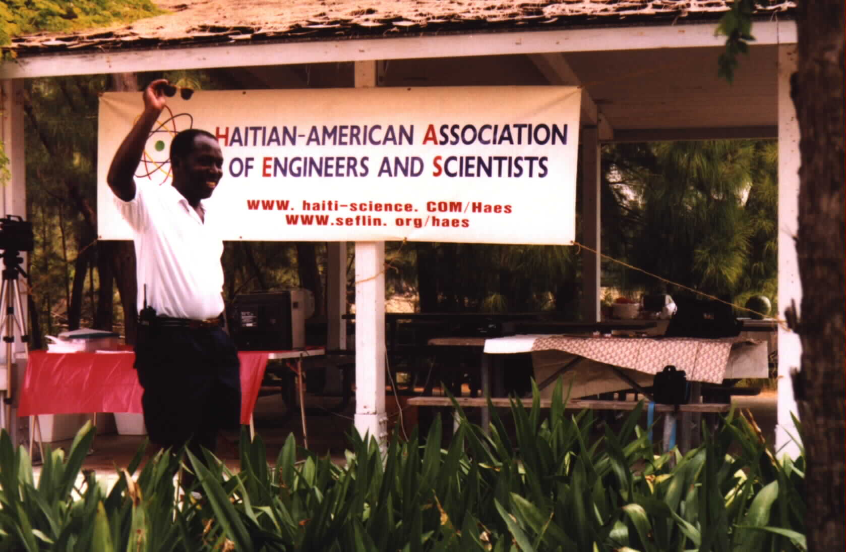 HAES 1998 Chairman Noe Dorestant standing in front of newly redesigned HAES banner for the picnic.(Picture provided by Noe Dorestant. Give credit where credit is due.)