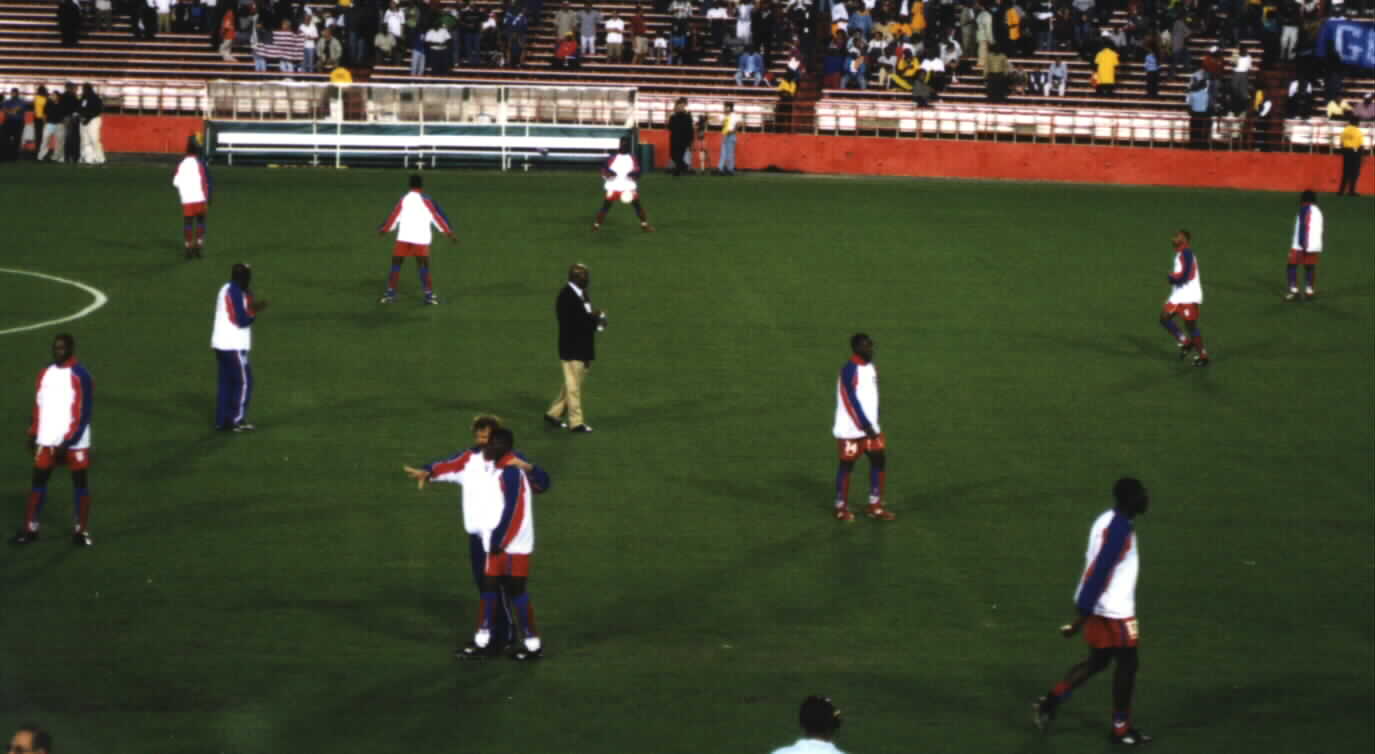 (French Technical coach, Bernard Souilliez advising a Haitian player before the game.)Picture courtesy of Noe Dorestant... Give credit where credit is due.