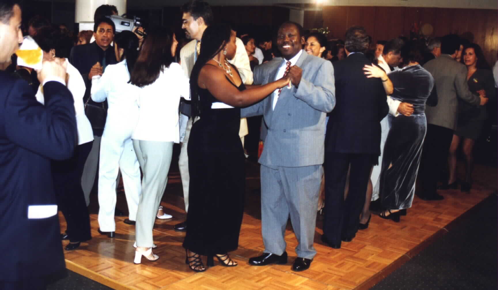 (HAES Chairman Noe Dorestant dancing with a Leader of the South Florida Consular
Cup Organization, Charlene of Surinam.)Picture taken by HAES Coordinator,
Romain Preal and provided by HAES Chairman, Noe Dorestant. If you copy for reuse,
give credit where credit is due. 