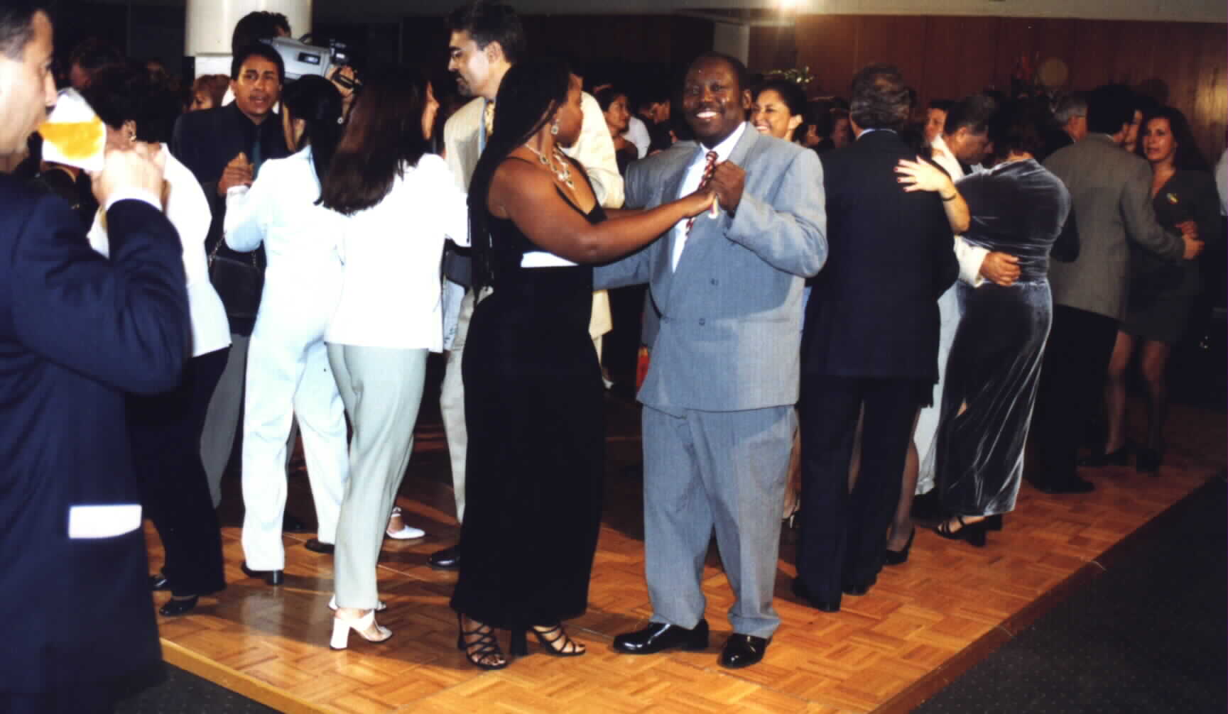 (HAES Chairman Noe Dorestant dancing with a Leader of the South Florida Consular
Cup Organization, Charlene of Surinam.)Picture taken by HAES Coordinator,
Romain Preal and provided by HAES Chairman, Noe Dorestant. If you copy for reuse,
give credit where credit is due. 