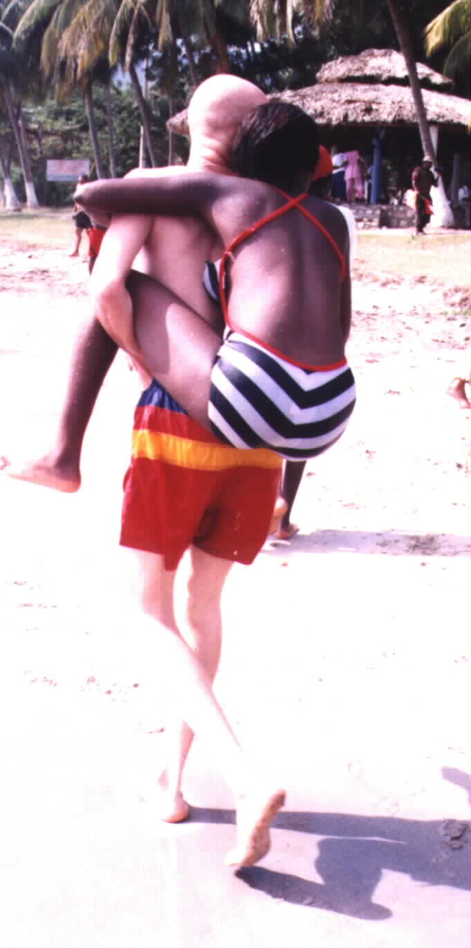 Rare glimpse of humanity on a beach near Jacmel: Haitians of all colors getting along and enjoying the sun and the beach in Haiti.(Picture taken by Noe Dorestant on 2/3/2002) If you plan to copy or reuse this picture, give credit where credit is due.