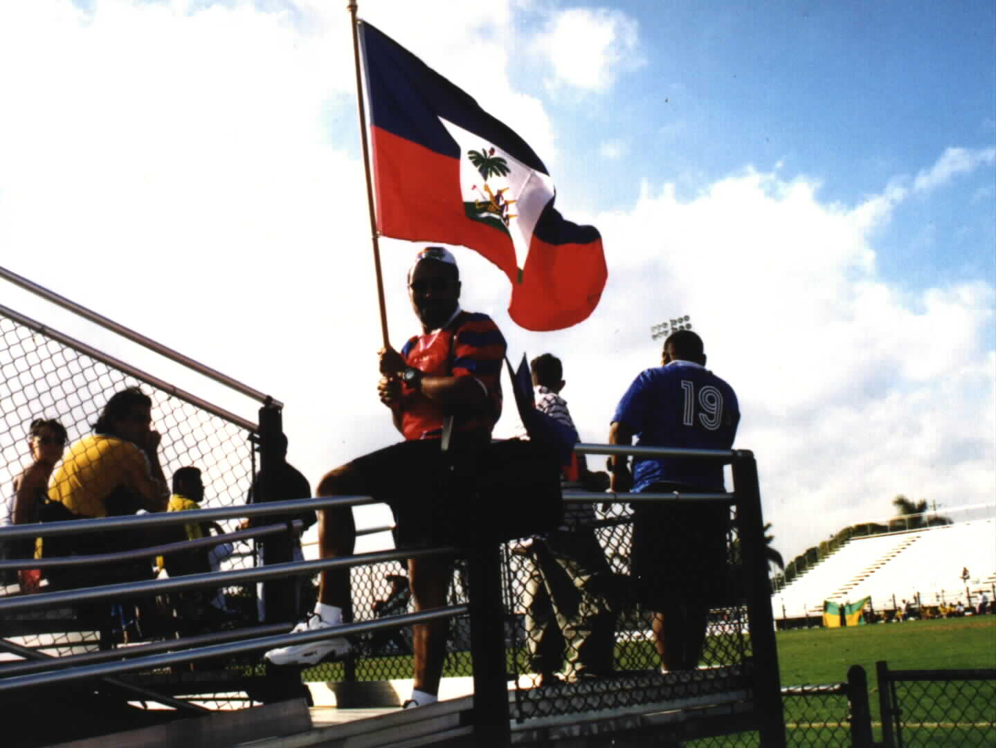 (Haitian fan flag bearer, ready for the action)Picture courtesy of Noe Dorestant... Give credit where credit is due.