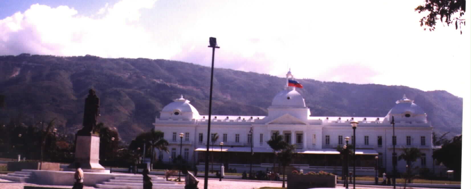 (Photographed by Noe Dorestant 1/28/2001: Haiti's national palace with the Haitian flag )Picture

photographed and provided by Noe Dorestant, if you copy for reuse, give credit where credit is due. 