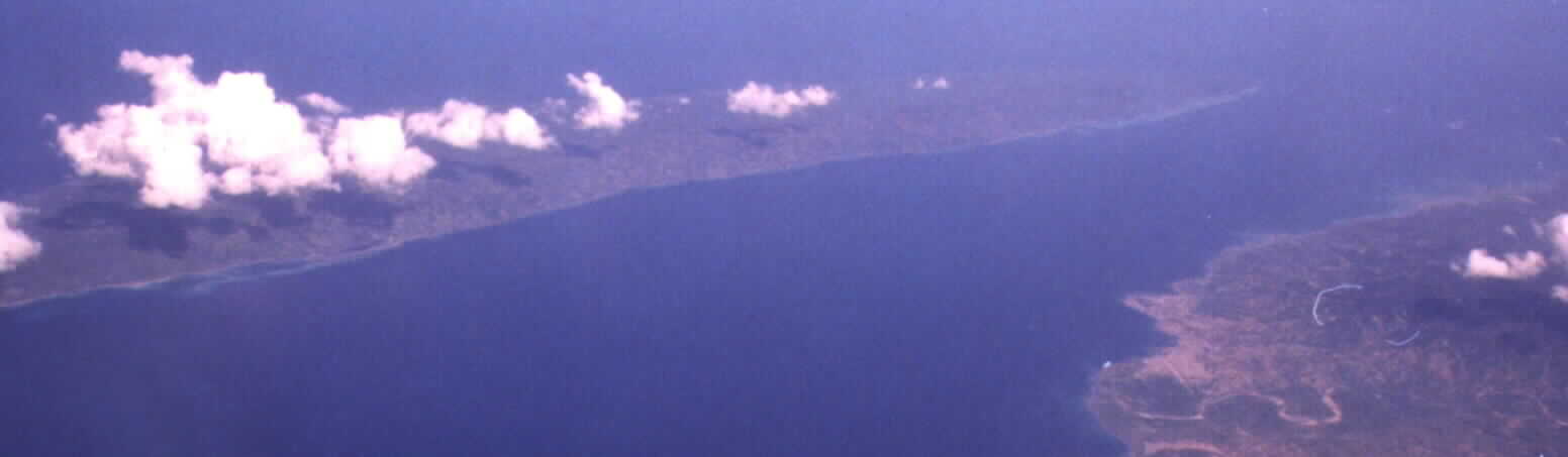 An aerial view of the nowrthwestern city of Port-de-Paix across the isle of Tortuga (Ile de la Tortue), Haiti W.I. Photographed by Noe Dorestant on February 4th, 2001.
