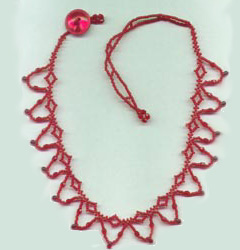 [photo of red anklet]