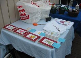Chris' beautiful rat watercolors with Jessica's t-shirt & RatFest auction prizes and raffle in the background.