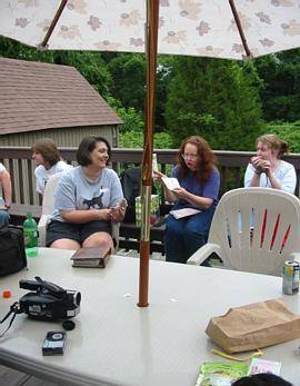 The ever fun and sometimes vicious gift exchange! (l-r): Beth, Chris, Ann, Jess.