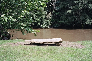 Or sit for a spell on the rock bench overlooking the river!