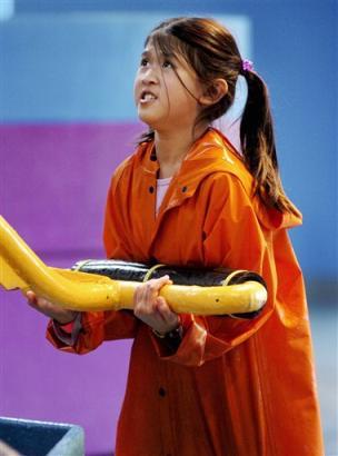Camille Hoang, 9, lifts the arm on a huge water pump, one of several physical activities at the museum that get kids moving while helping them learn, at the Chicago Children's Museum Saturday, Oct. 16, 2004 in Chicago. The American Medical Association has singled out a project, Consortium to Lower Obesity in Chicago Children or CLOCC, as a model for how communities can tackle the nation's obesity epidemic. The consortium will be the subject of the AMA's two-day obesity 'summit' starting Tuesday, Oct. 19. (AP Photo/Jeff Roberson)