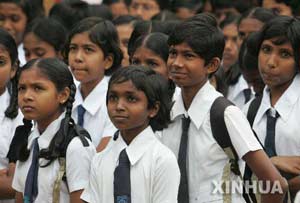 Sri Lankan school children went back to school Monday after the devastating Tsunami disaster hit the country two weeks ago.