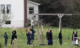 A group of Amish children play volleball during a recess from their school day in Middlefield, Ohio, Friday, April 22, 2005. (AP Photo/Amy Sancetta)