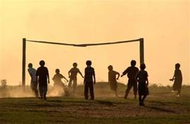 Children from the Toba Qom ethnic group play soccer during Indegenous Indian Day celebration in Cerrito, 45 milles from Asuncion, Paraguay on Tuesday, April 19, 2005. Only 900 members of 'Toba Qom' ethnic group are still  living in Paraguay. (AP Photo/Jorge Saenz)