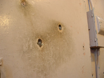 Bullet holes from a riot