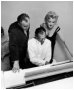 Marilyn with husband Arthur Miller playing the piano gifted by her mom 